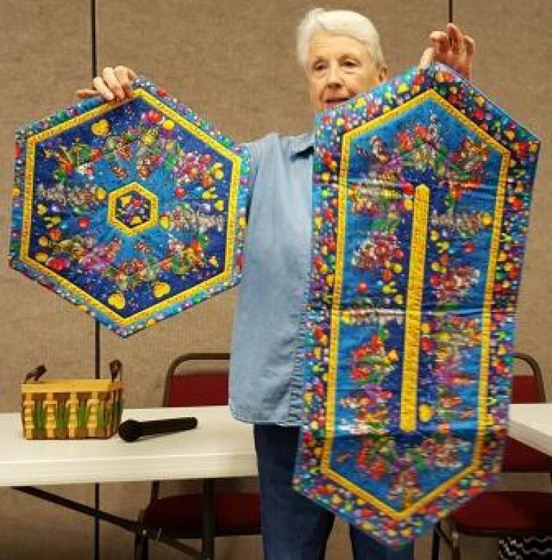 Tina G has made a table topper and runner for our silent auction at the the Quilt Show
